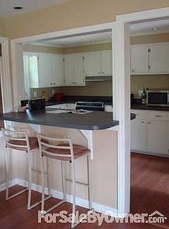Kitchen and Breakfast Bar : A cook's kitchen with plenty of room and storage.
