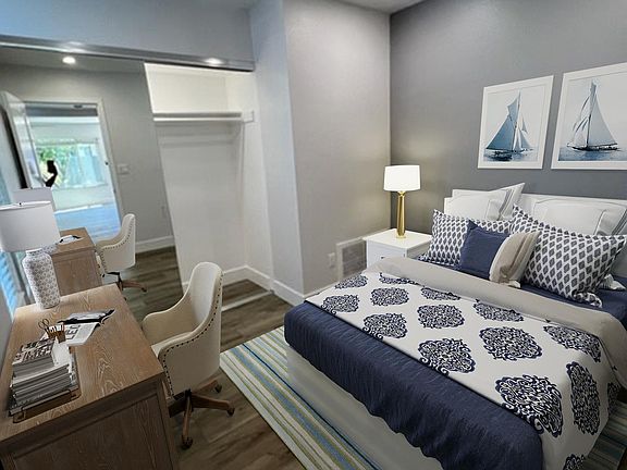 downstairs bedroom with large mirrored closet