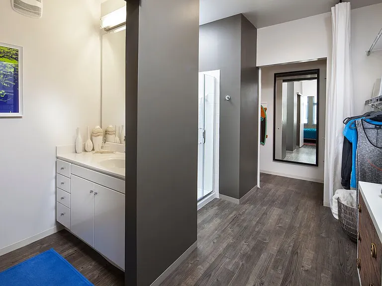 Classic Package I and II bath with white laminate countertops, white cabinetry, and hard surface flooring