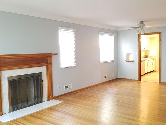 huge bright living room and dining area with all new blinds and beautiful hardwood floors!