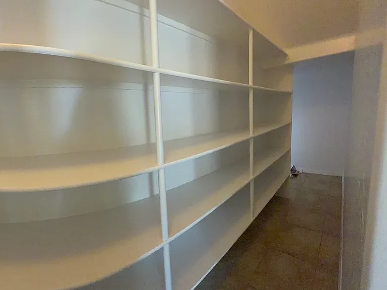 Huge Walk In Pantry that runs the length of the kitchen