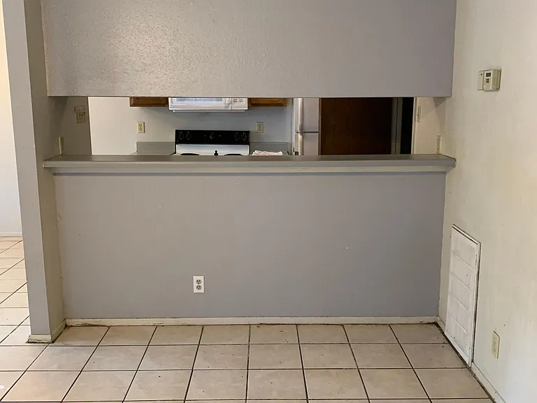 Breakfast Bar Area with ceramic tile.