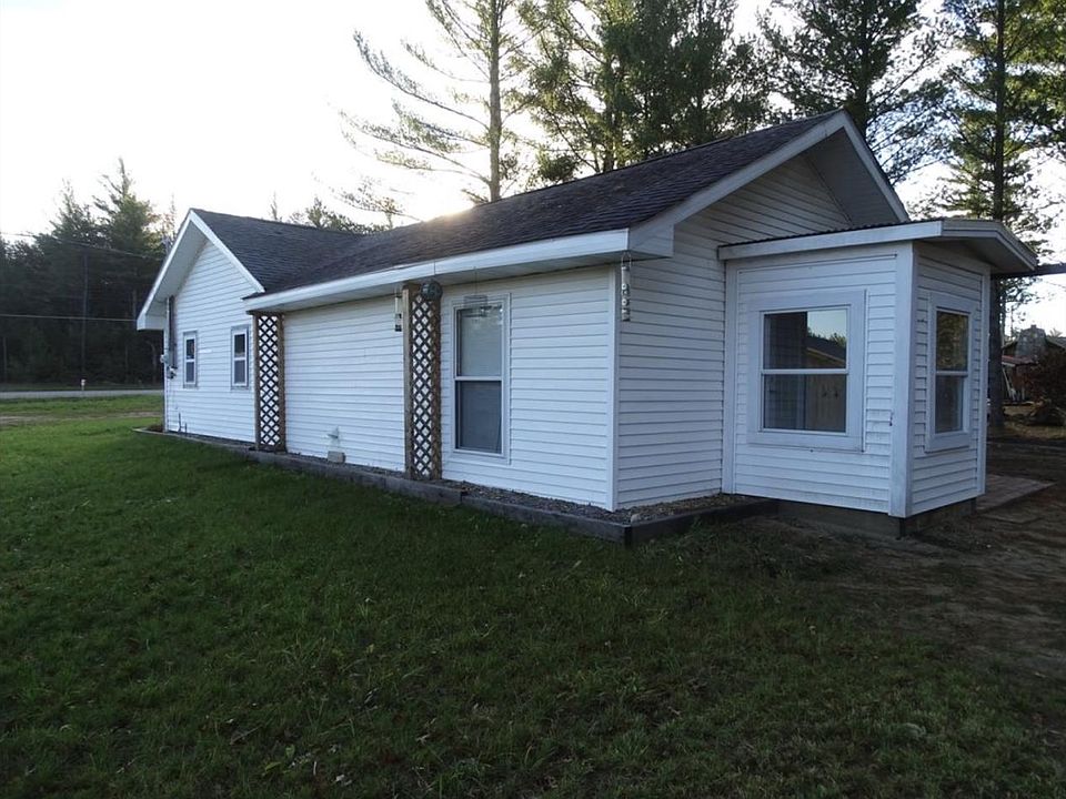back of home with woods behind