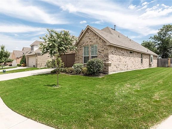 Home sits on a corner lot and backs up to the Greenbelt.