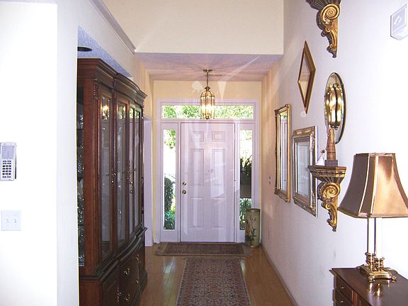 Elegant entry with hardwoods and lighted niche