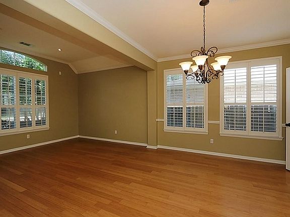 Beautiful formals upon entering home with detail and plantation shutters.