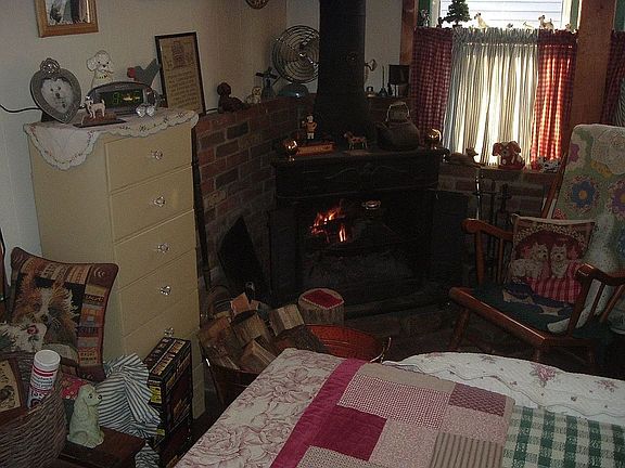 bedroom with wood burning stove