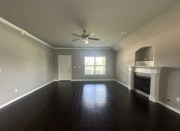 Large open floor plan with hardwood floors.