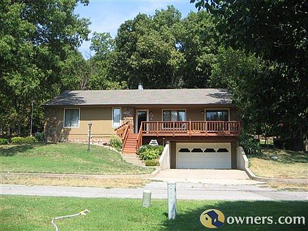 Front view of house and deck.