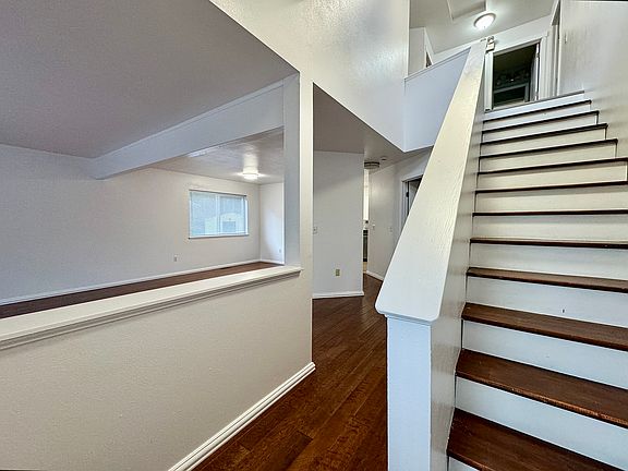 ENTRANCE AND WOODEN STAIRS