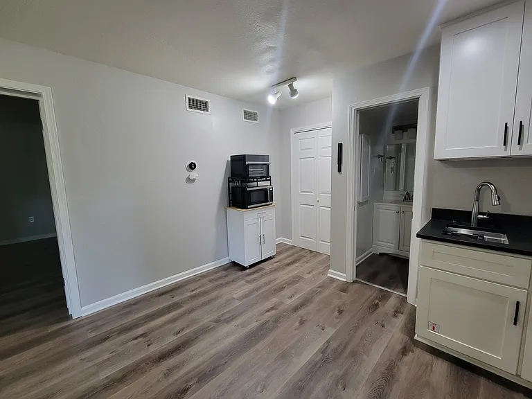 Dining area with oven/airfryer and microwave on moveable cart