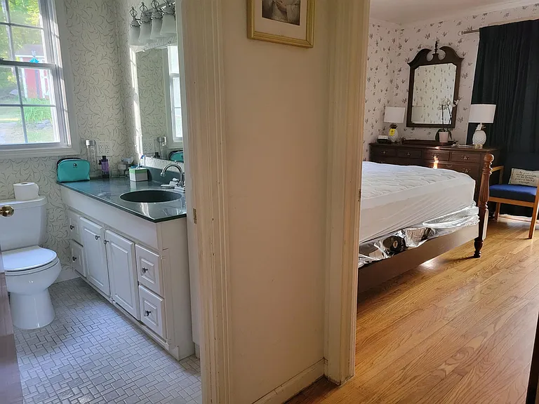 Master and bath right next door. Private Full bath. View of woods.