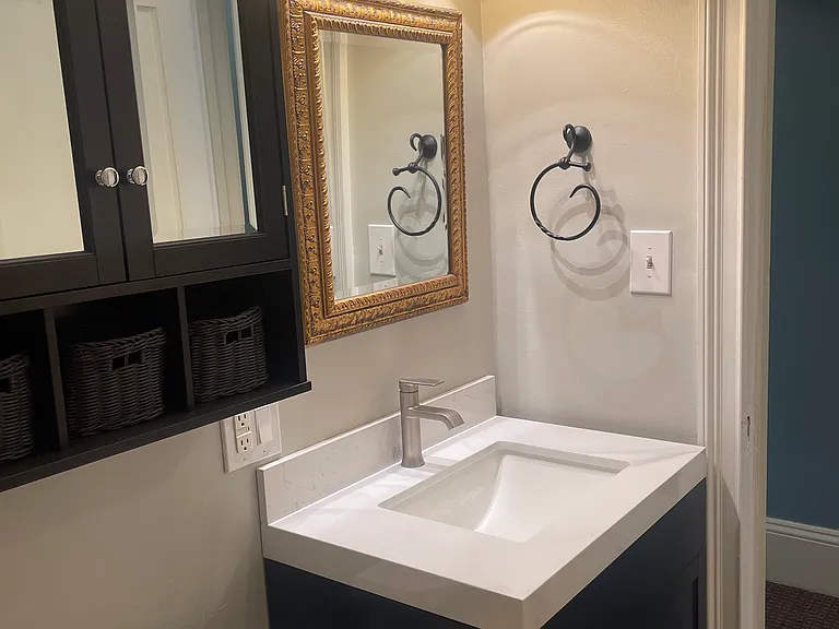 bathroom with new marble top fixture and new 3 light comtemporary led