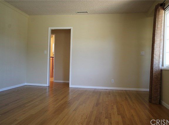 Living room with original wood floors--