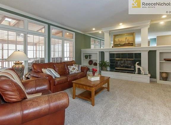 Spacious great room has fireplace with built ins.
