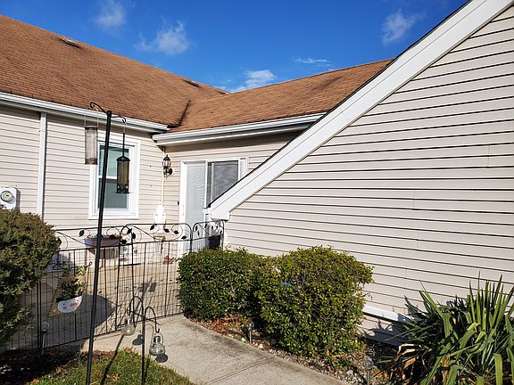 Back of house with patio