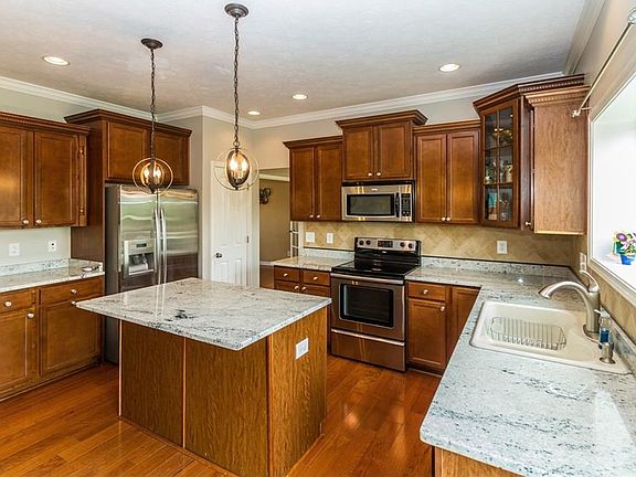 Lots of cabinets for storage. Slide out drawers for pots and pans.