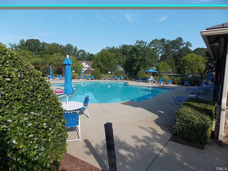 Community pool that is across the house