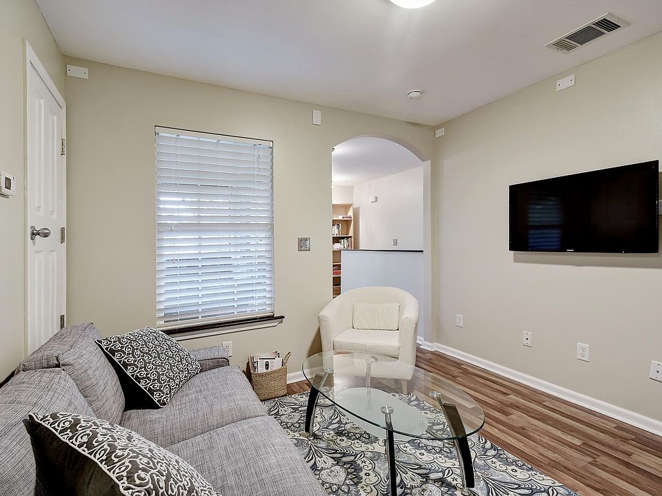 Living room, sofa, coffee table and chair, 48" TV.