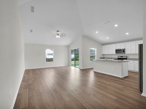 This open-concept floor plan allows you to move freely from the kitchen to the family room