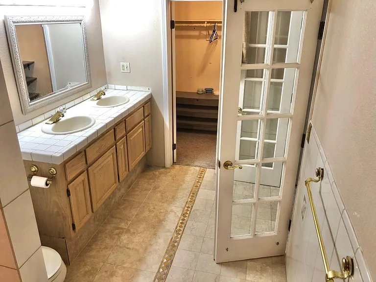 master bedroom private bathroom and closet inside bathroom