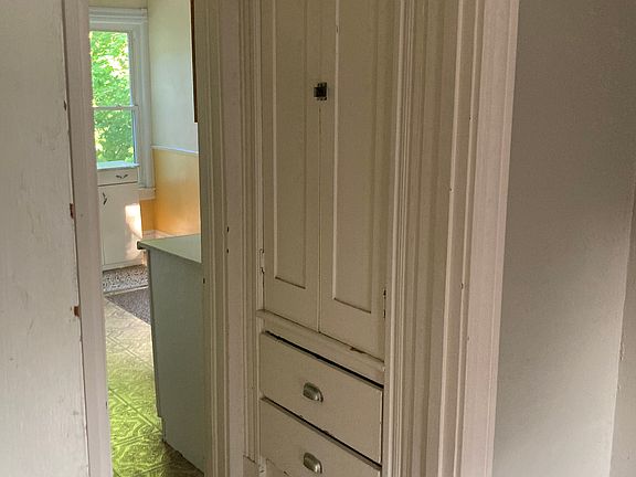 Storage in hallway between kitchen and living room/bedroom combo