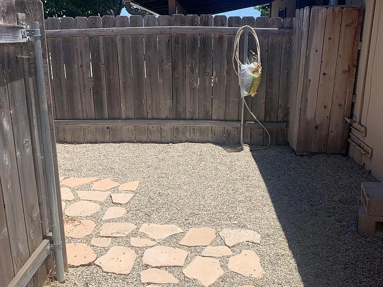 private back yard (accessible via driveway or garage)