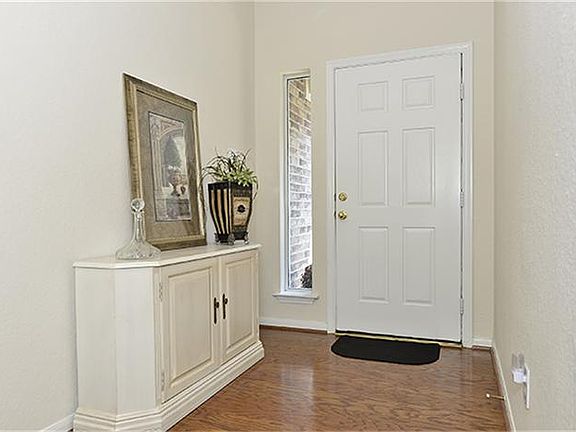 Entry shows off the pretty hardwood flooring