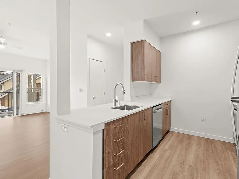 Discover your ideal living space with the option of two interior color schemes, including kitchen cabinets inspired by the warmth of walnut or the modern allure of ash wood.
