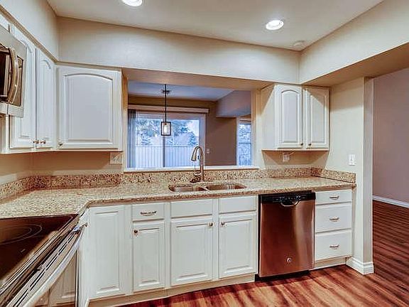Kitchen with granite counter-tops & stainless steel appliances
