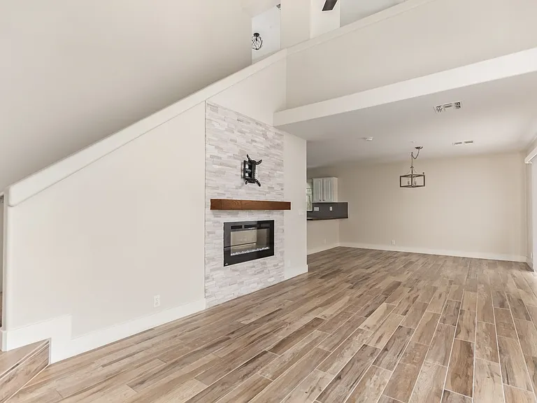 Living Room with Fireplace. Hardware above the fireplace is ready for your TV