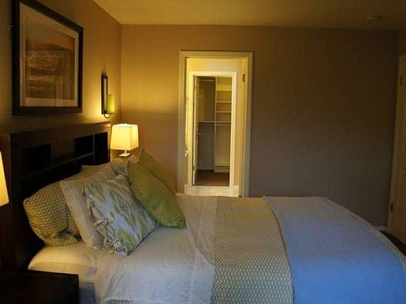 Master bedroom with master bathroom and large walk-in closet