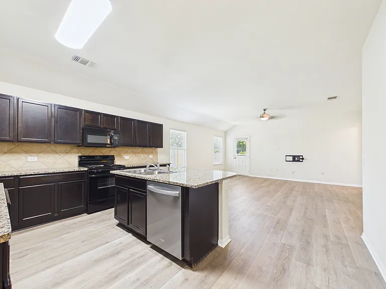 Kitchen open to spacious living area