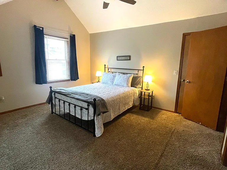 King bed, ceiling fan and lots of natural light