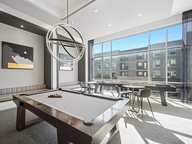 Game room with shuffleboard and billiards