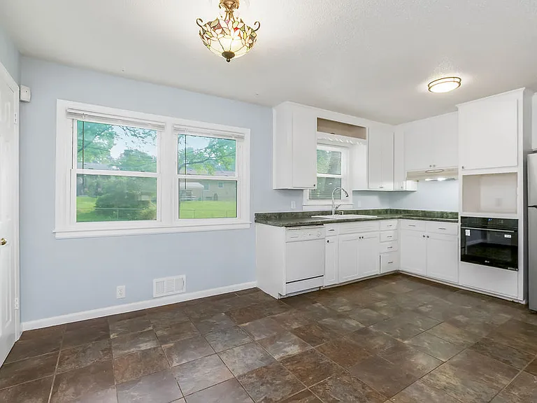 kitchen has microwave in-set with a plug-in
