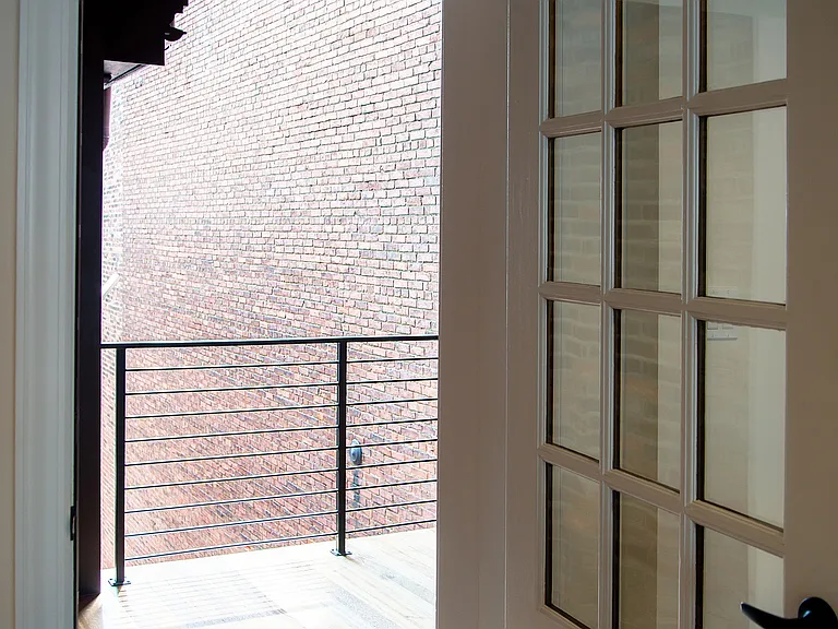 Step into your serene retreat with this charming balcony view.
