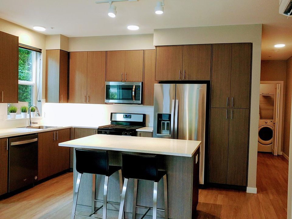 Kitchen with island. Ample cabinet storage.