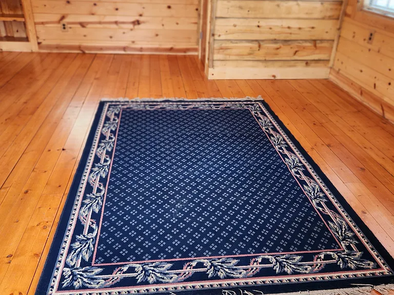 Several area rugs are included.