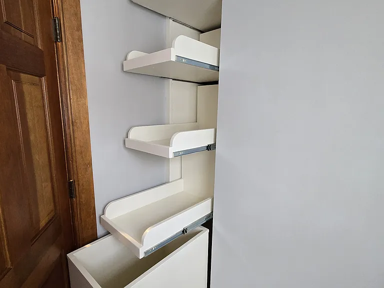 Laundry room with linen storage