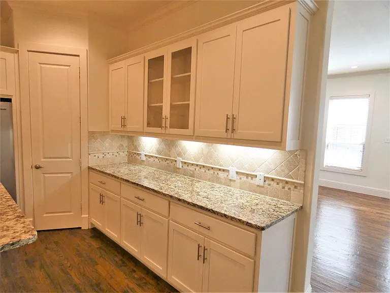 Lots of cabinets and granite counters!