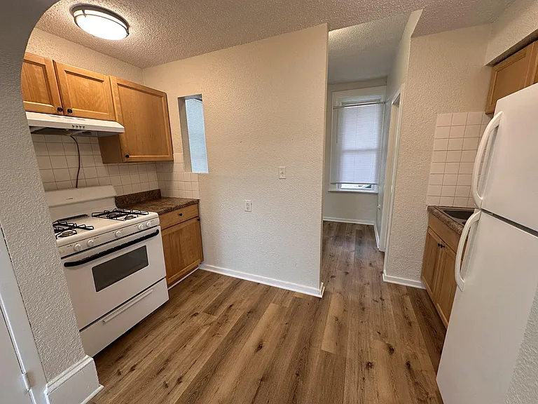 Kitchen looking into bedroom