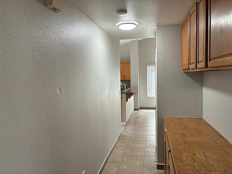Extra cabinets in the path towards bedrooms