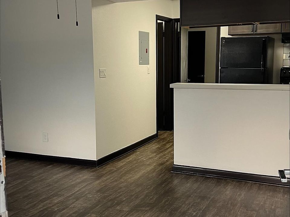 Standing in front door looking in.