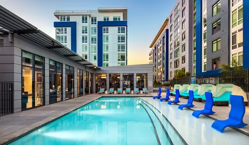 Lounge on the outdoor sundeck or go for a swim in the saltwater swimming pool - Indigo Apartments