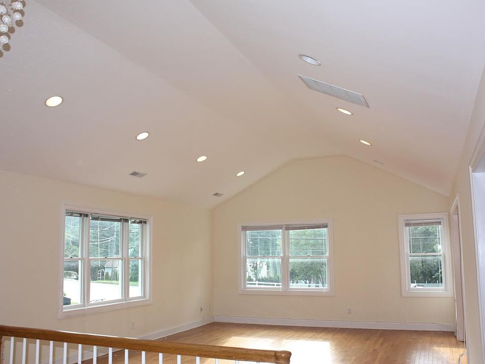 Living room with plenty of natural of and overhead lighting
