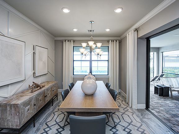 Dining area open to kitchen, showing optional zero-corner slider and extended lanai