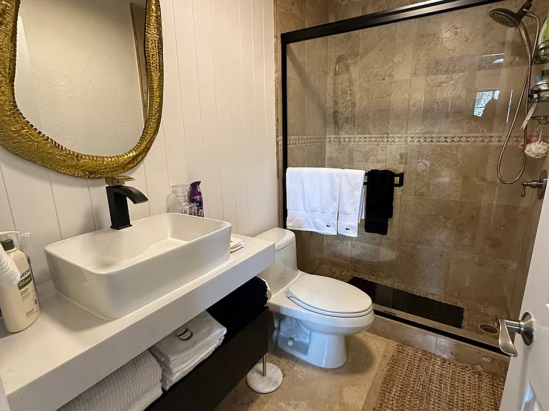 Fully Renovated Master Bathroom with Marble-Tiled Shower