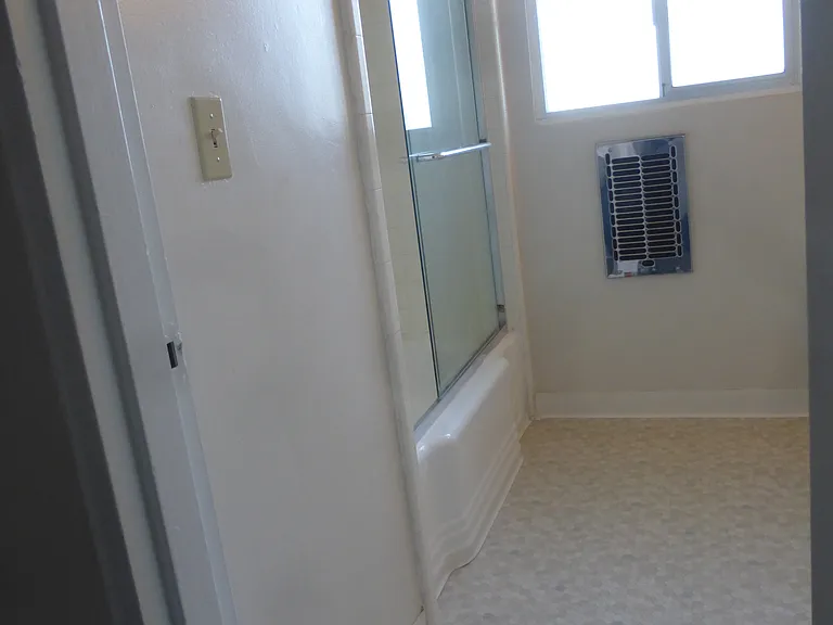Bathroom - lino flooring - glass sliding door