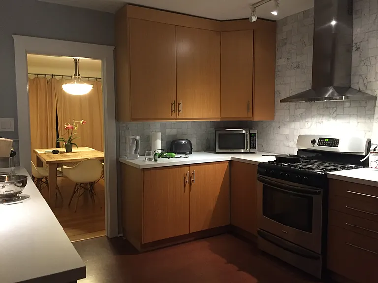 View of dining from kitchen at night.